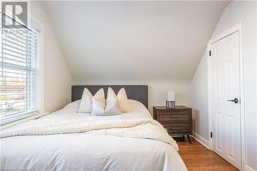 Bedroom featuring multiple windows, wood-type flooring, and lofted ceiling - 645 Weber Street E, Kitchener, ON - Indoor Photo Showing Bedroom