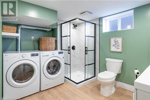 Laundry area featuring light hardwood / wood-style floors and washer and dryer - 645 Weber Street E, Kitchener, ON - Indoor Photo Showing Laundry Room