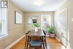 Dining area with light hardwood / wood-style floors and plenty of natural light - 