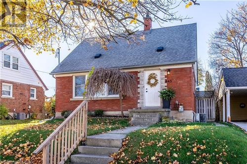 View of front of house with cooling unit and a front yard - 645 Weber Street E, Kitchener, ON - Outdoor