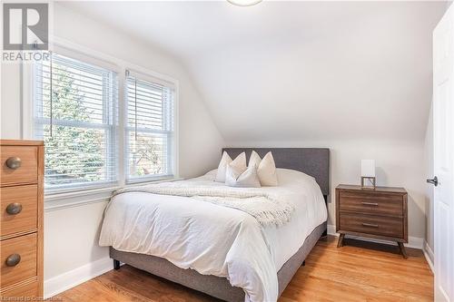 Bedroom featuring wood-type flooring, multiple windows, and vaulted ceiling - 645 Weber Street E, Kitchener, ON - Indoor Photo Showing Bedroom