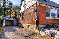 View of home's exterior featuring an outbuilding and a garage - 