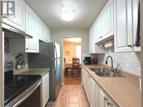 515 - 358 Queen Mary Road, Kingston (West Of Sir John A. Blvd), ON - Indoor Photo Showing Kitchen With Double Sink