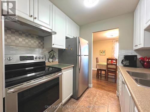 515 - 358 Queen Mary Road, Kingston (West Of Sir John A. Blvd), ON - Indoor Photo Showing Kitchen With Stainless Steel Kitchen With Double Sink