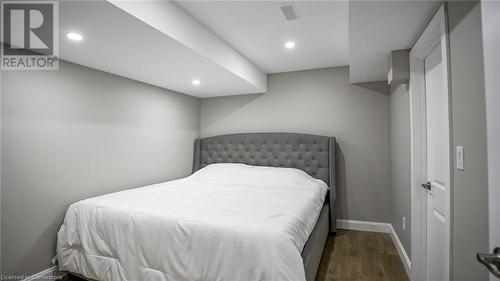 Bedroom featuring dark wood-type flooring - 219 Falconridge Drive, Waterloo, ON - Indoor Photo Showing Bedroom