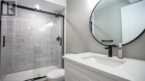 Bathroom with a shower with shower door, vanity, and toilet - 219 Falconridge Drive, Waterloo, ON - Indoor Photo Showing Bathroom