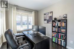 Office space featuring dark wood-type flooring - 