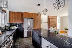 View of Kitchen and Living Room - Modern Quartz Counters with Character! Imagine Cozy evenings Cooking with a Wood Fire on! - 