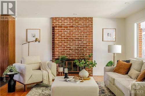 Straight View into Living Room - Beautiful Brick Wall with Wood Fireplace - 9 Kingsford Crescent, Kanata, ON - Indoor Photo Showing Living Room