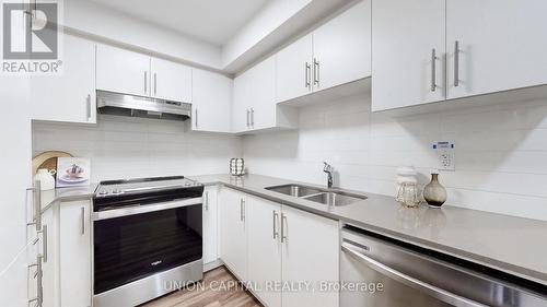 49 - 5 William Jackson Way, Toronto, ON - Indoor Photo Showing Kitchen With Double Sink