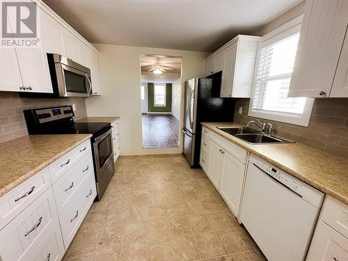 1117 105 Avenue, Dawson Creek, BC - Indoor Photo Showing Kitchen With Double Sink