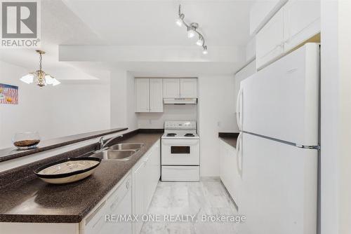 909 - 7 Lorraine Drive, Toronto, ON - Indoor Photo Showing Kitchen With Double Sink