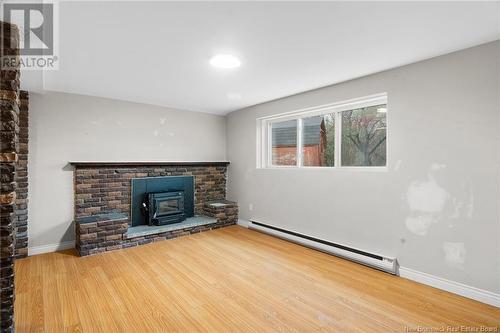 47 Christopher Drive, Burton, NB - Indoor Photo Showing Living Room With Fireplace