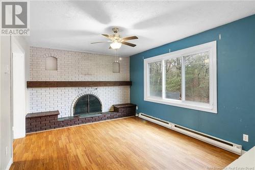 47 Christopher Drive, Burton, NB - Indoor Photo Showing Other Room With Fireplace