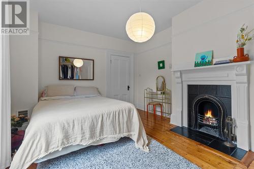 24 Victoria Street, St. John'S, NL - Indoor Photo Showing Bedroom With Fireplace