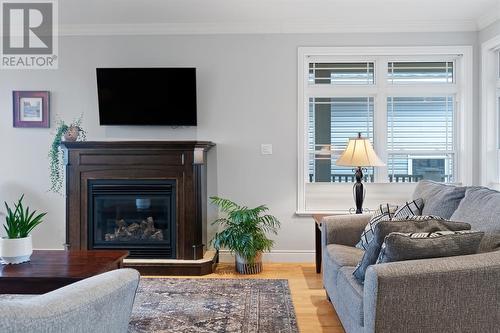 7 Atlantica Drive, Paradise, NL - Indoor Photo Showing Living Room With Fireplace