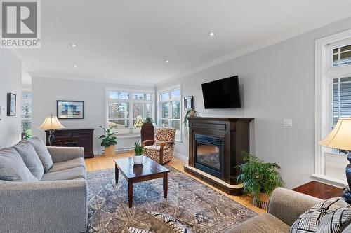 7 Atlantica Drive, Paradise, NL - Indoor Photo Showing Living Room With Fireplace