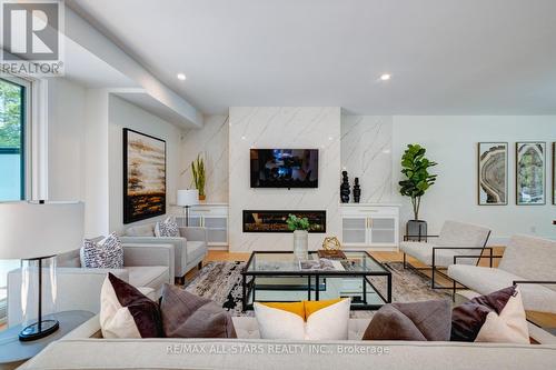 4 Tredvalley Grove, Toronto, ON - Indoor Photo Showing Living Room