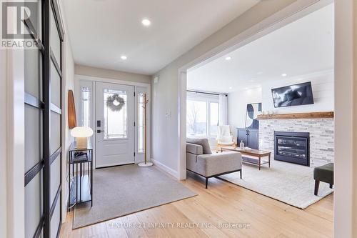 64 Bradley Boulevard, Clarington, ON - Indoor Photo Showing Living Room With Fireplace