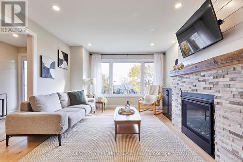 64 Bradley Boulevard, Clarington, ON - Indoor Photo Showing Living Room With Fireplace