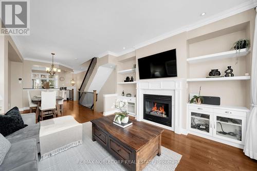 8 - 275 Van Dusen Boulevard, Toronto, ON - Indoor Photo Showing Living Room With Fireplace