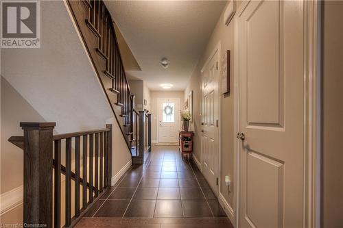 Main floor hallway with door to fully drywalled garage. - 625 Blackbridge Road Unit# 12, Cambridge, ON - Indoor Photo Showing Other Room