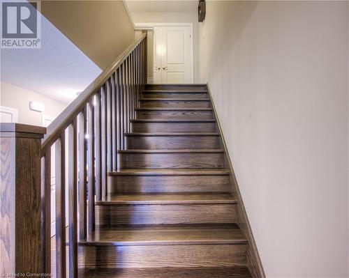 Upgraded hardwood staircase leading to the upper level. - 625 Blackbridge Road Unit# 12, Cambridge, ON - Indoor Photo Showing Other Room