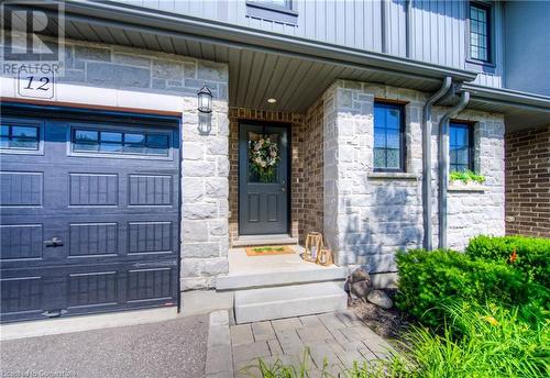 Insulated fiberglass front door, front concrete porch and decorative address stone. - 625 Blackbridge Road Unit# 12, Cambridge, ON - Outdoor