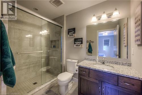 Ensuite bathroom with walk in shower, tiled niche and sliding glass doors. Custom oak vanity with drawers and granite countertop. - 625 Blackbridge Road Unit# 12, Cambridge, ON - Indoor Photo Showing Bathroom