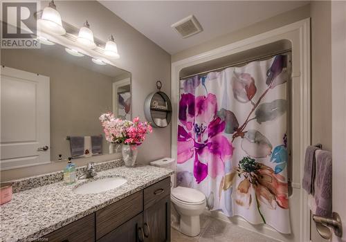 4 piece bathroom with acrylic bathtub surround, oak vanity with drawers, granite countertop and Moen faucets. All toilets are dual flush. - 625 Blackbridge Road Unit# 12, Cambridge, ON - Indoor Photo Showing Bathroom