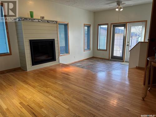 723 Dieppe Drive, Weyburn, SK - Indoor Photo Showing Other Room With Fireplace