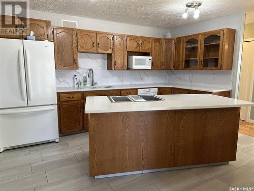 723 Dieppe Drive, Weyburn, SK - Indoor Photo Showing Kitchen With Double Sink