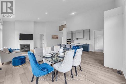 119 Sladden Court, Blue Mountains, ON - Indoor Photo Showing Dining Room With Fireplace