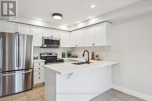 4880 Verdi Street, Burlington, ON - Indoor Photo Showing Kitchen With Stainless Steel Kitchen With Double Sink