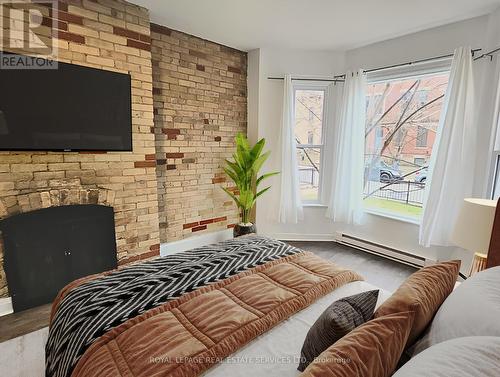 1 - 118 Pembroke Street, Toronto, ON - Indoor Photo Showing Bedroom With Fireplace