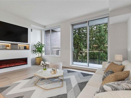 320-2000 Hannington Rd, Langford, BC - Indoor Photo Showing Living Room With Fireplace