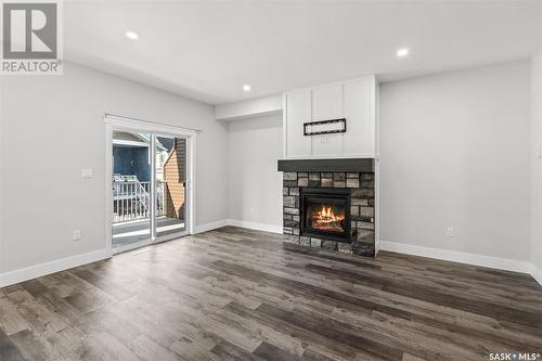 71 900 St Andrews Lane, Warman, SK - Indoor Photo Showing Living Room With Fireplace