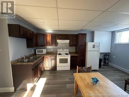 10 Malcolm Avenue, Campbellton, NB - Indoor Photo Showing Kitchen With Double Sink