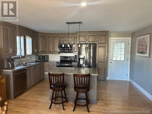 10 Malcolm Avenue, Campbellton, NB - Indoor Photo Showing Kitchen With Double Sink