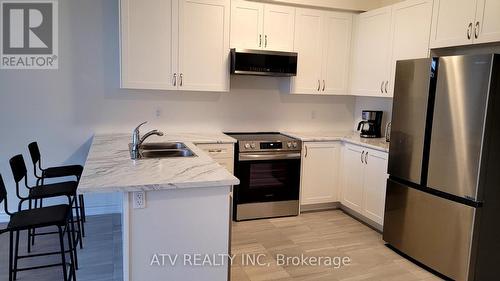 2135 Speare Court, Innisfil, ON - Indoor Photo Showing Kitchen With Stainless Steel Kitchen With Double Sink