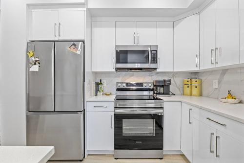 7-1354 Rutland Road, Kelowna, BC - Indoor Photo Showing Kitchen With Stainless Steel Kitchen