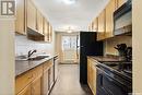 7 1811 8Th Avenue N, Regina, SK  - Indoor Photo Showing Kitchen With Double Sink 