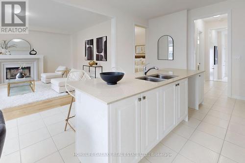 31 Sambro Lane, Whitchurch-Stouffville, ON - Indoor Photo Showing Kitchen With Fireplace With Double Sink