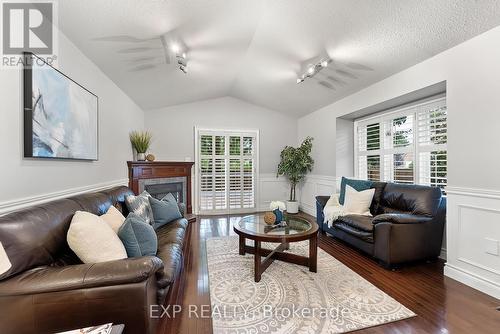 7949 Grossi Court, Niagara Falls, ON - Indoor Photo Showing Living Room With Fireplace