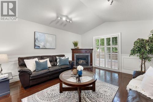 7949 Grossi Court, Niagara Falls, ON - Indoor Photo Showing Living Room With Fireplace