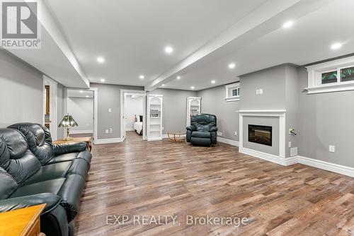 7949 Grossi Court, Niagara Falls, ON - Indoor Photo Showing Living Room With Fireplace