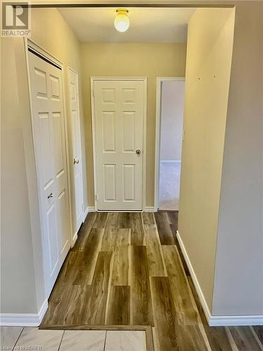 Hallway with wood-type flooring - 810 Main Street W Unit# 302, North Bay, ON - Indoor Photo Showing Other Room