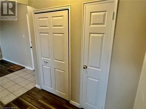 Hallway with dark hardwood / wood-style flooring - 810 Main Street W Unit# 302, North Bay, ON - Indoor Photo Showing Other Room