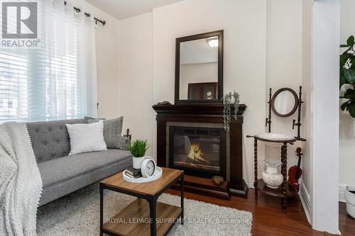 8 Blakley Avenue, Toronto, ON - Indoor Photo Showing Living Room With Fireplace