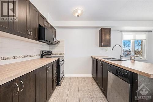 701 Sue Holloway Drive Unit#C, Ottawa, ON - Indoor Photo Showing Kitchen With Double Sink